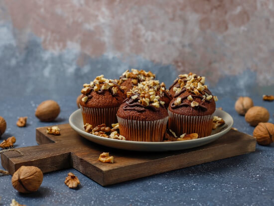chocolate-walnut-muffins-with-coffee-cup-with-walnuts-dark=surface