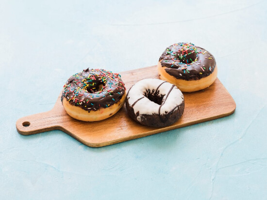 fresh-chocolate-donuts-chopping-board