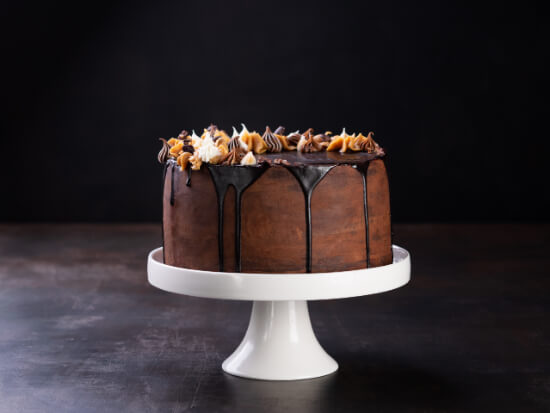 tasty-chocolate-drip-cake-with-melting-chocolate-dark